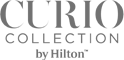 A cropped grey image showing only a partial dark letter or character on the right side.